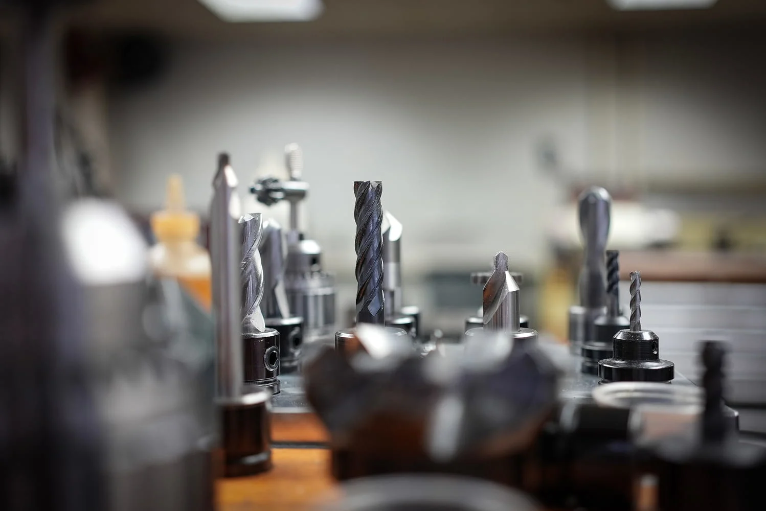 Precision carbide end mills and drill bits in tool holders ready for CNC machining