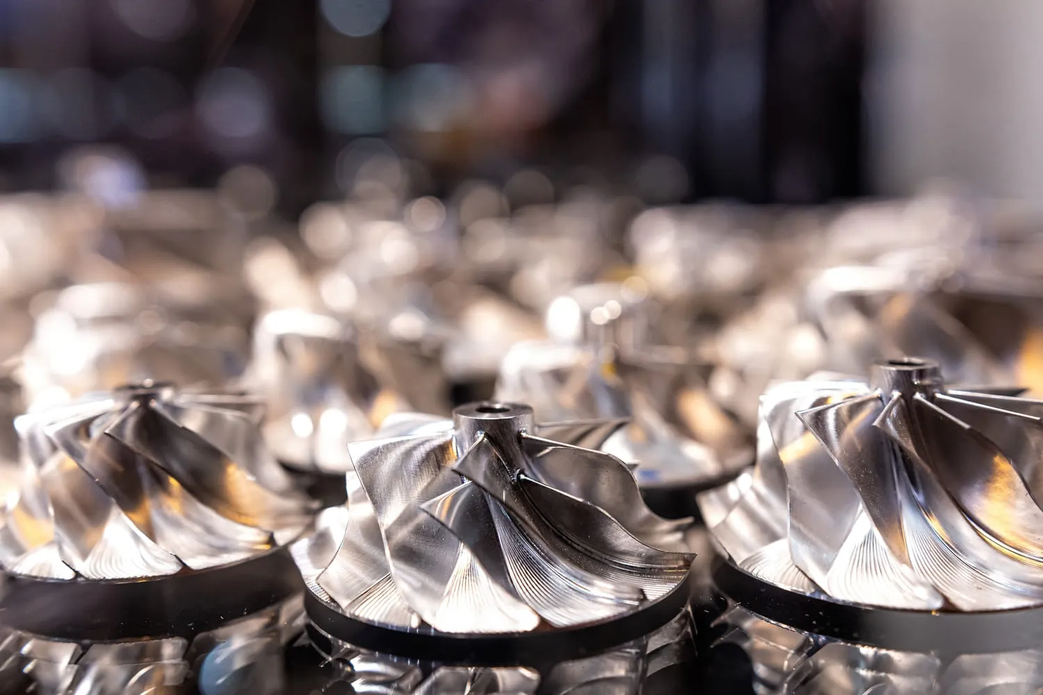 Batch of precision-machined stainless steel impellers for food and beverage processing equipment