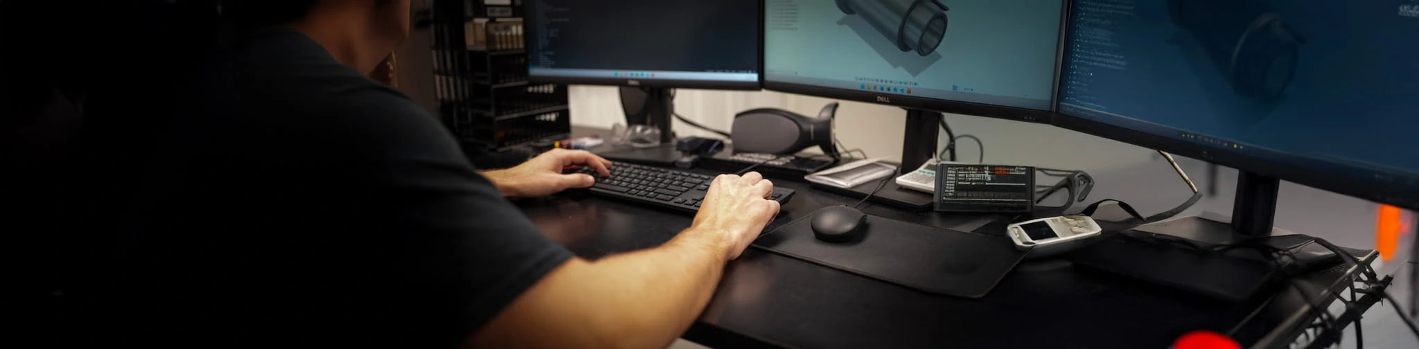 ETG support technician working at a computer workstation ready to assist customers