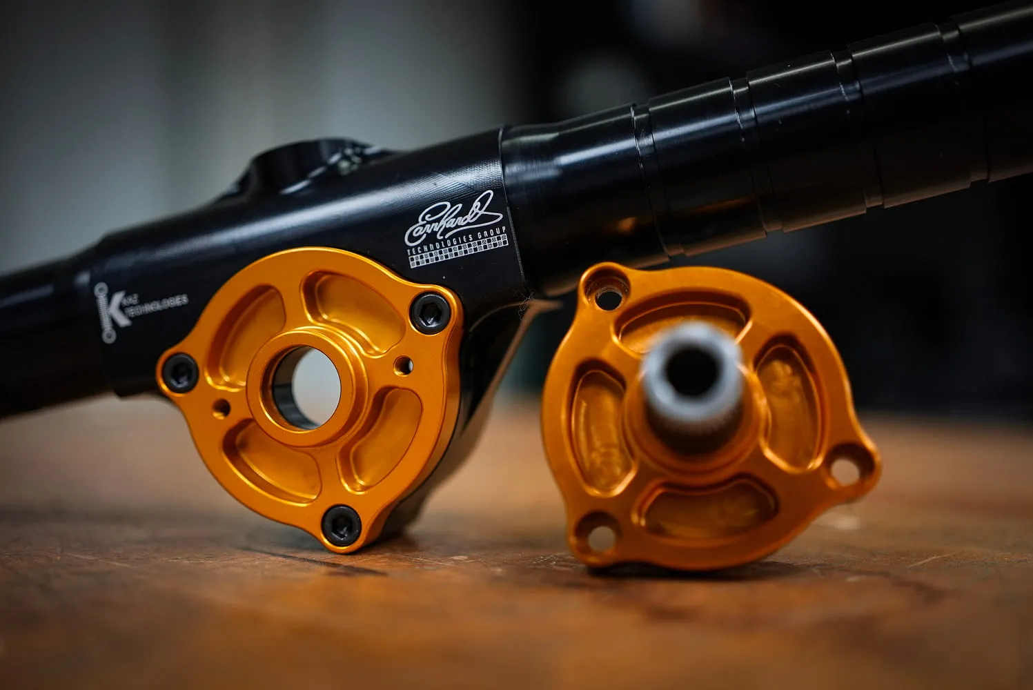 ETG black anodized sway bar arm with orange anodized aluminum mounting flanges