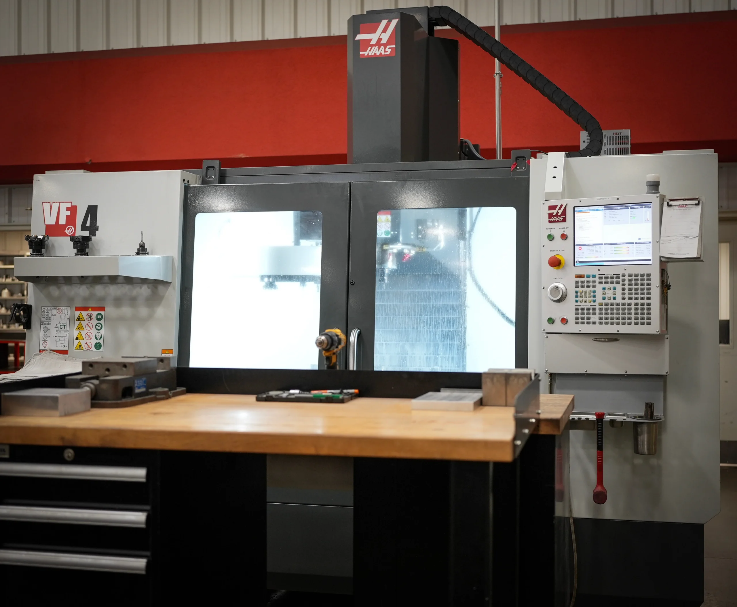 Haas VF-4 3-axis CNC vertical milling machine with 50-inch X-axis travel and control panel