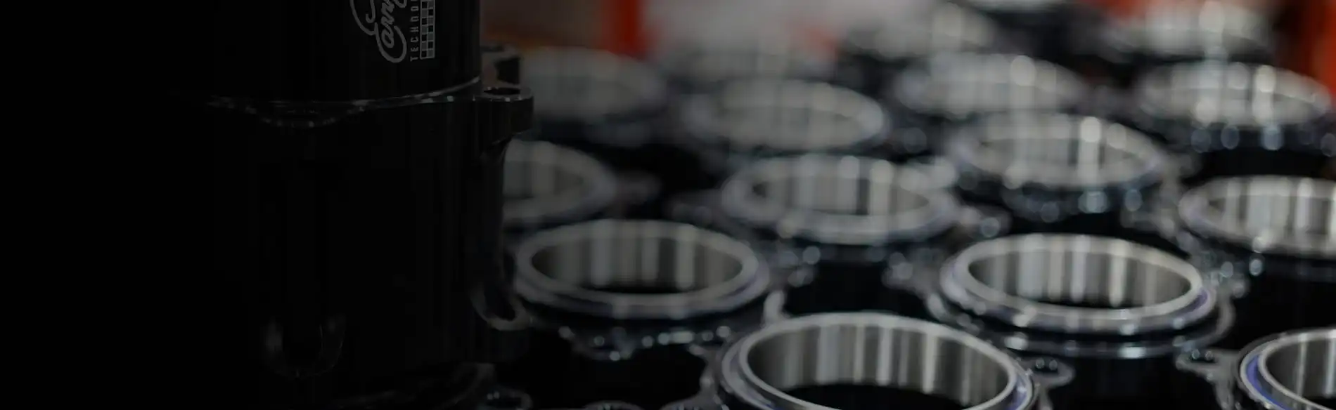 Black anodized ETG drivetrain hub with precision-machined bearing races in production